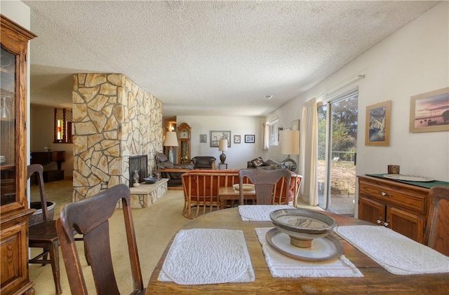 2661 Southview Ave, Arroyo Grande, CA 93420 - dining area with a textured ceiling, a fireplace, and carpet flooring