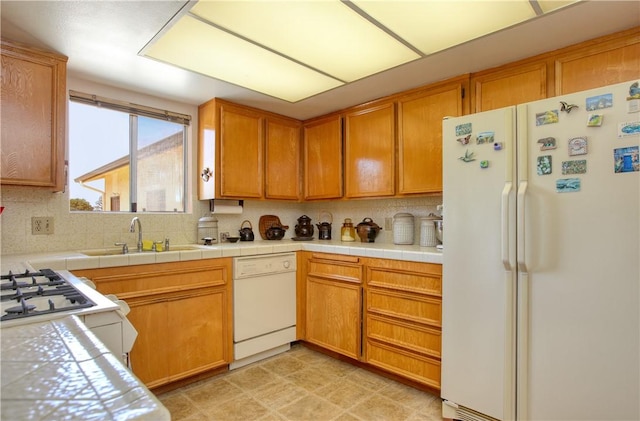 2661 Southview Ave, Arroyo Grande, CA 93420 - kitchen featuring white appliances, a sink, tasteful backsplash, and brown cabinetry