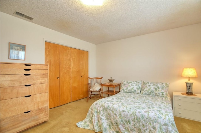 2661 Southview Ave, Arroyo Grande, CA 93420 - bedroom featuring light carpet, a closet, and a textured ceiling