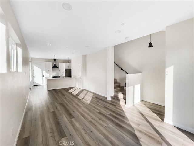 4048 Cherokee Ave, San Diego, CA 92104 - unfurnished living room with stairway, light wood-style flooring, and baseboards