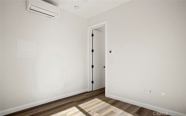 4048 Cherokee Ave, San Diego, CA 92104 - unfurnished room featuring a wall mounted air conditioner, wood finished floors, baseboards, and a smoke detector