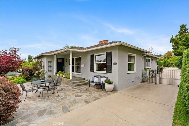 1981 Sinaloa Ave, Altadena, CA 91001 - back of house featuring stucco siding, a chimney, and a patio area