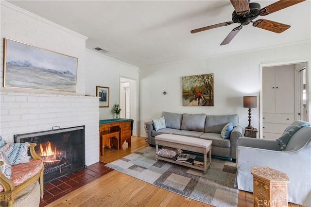 1981 Sinaloa Ave, Altadena, CA 91001 - living area featuring wood-type flooring, crown molding, a ceiling fan, and a fireplace