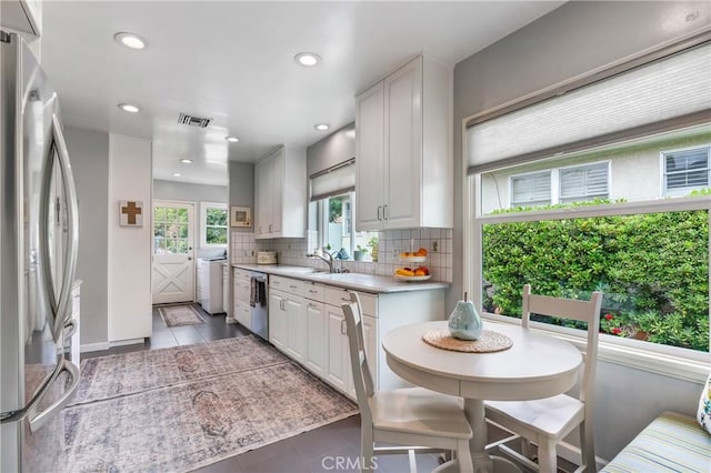 1981 Sinaloa Ave, Altadena, CA 91001 - kitchen featuring stainless steel appliances, decorative backsplash, tile patterned flooring, light countertops, and white cabinetry
