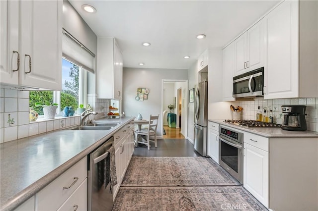 1981 Sinaloa Ave, Altadena, CA 91001 - kitchen featuring stainless steel appliances, a sink, decorative backsplash, white cabinets, and recessed lighting