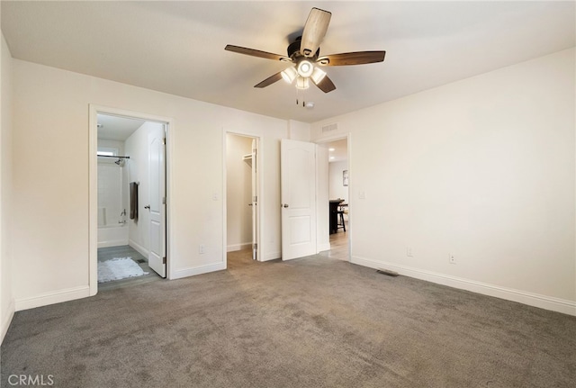 1612 San Jose Ln, Paradise, CA 95969 - unfurnished bedroom with a walk in closet, carpet floors, baseboards, ensuite bath, and a closet