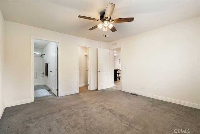 1612 San Jose Ln, Paradise, CA 95969 - unfurnished bedroom with carpet, a spacious closet, ensuite bathroom, a closet, and a ceiling fan
