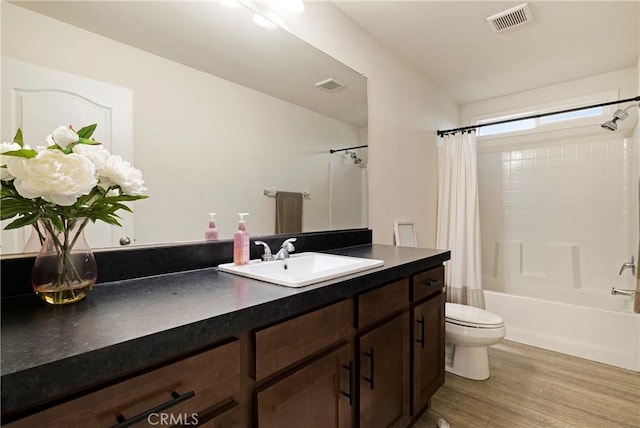 1612 San Jose Ln, Paradise, CA 95969 - full bathroom with vanity, shower / bath combo, toilet, and wood finished floors