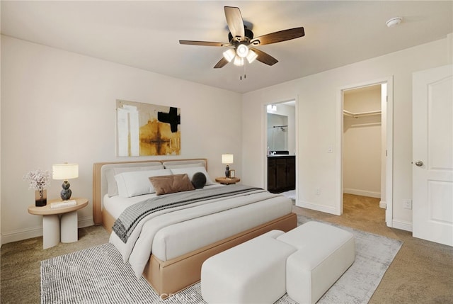 1612 San Jose Ln, Paradise, CA 95969 - bedroom with carpet floors, a walk in closet, baseboards, ensuite bath, and a ceiling fan