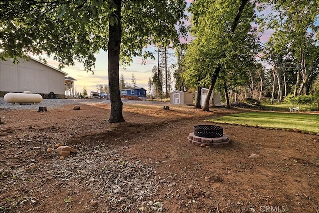 1612 San Jose Ln, Paradise, CA 95969 - view of yard with a fire pit