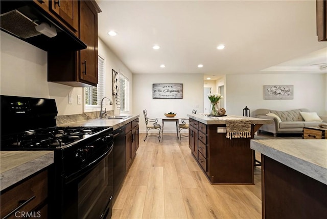 1612 San Jose Ln, Paradise, CA 95969 - kitchen with black appliances, a sink, under cabinet range hood, recessed lighting, and light wood-style floors