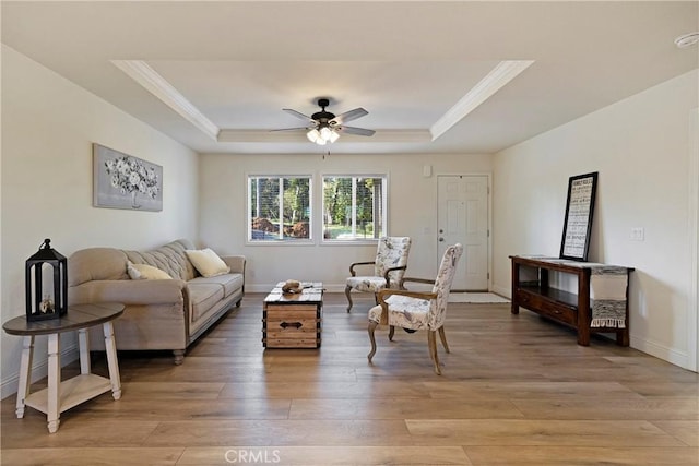 1612 San Jose Ln, Paradise, CA 95969 - living room with a raised ceiling, crown molding, a ceiling fan, light wood finished floors, and baseboards