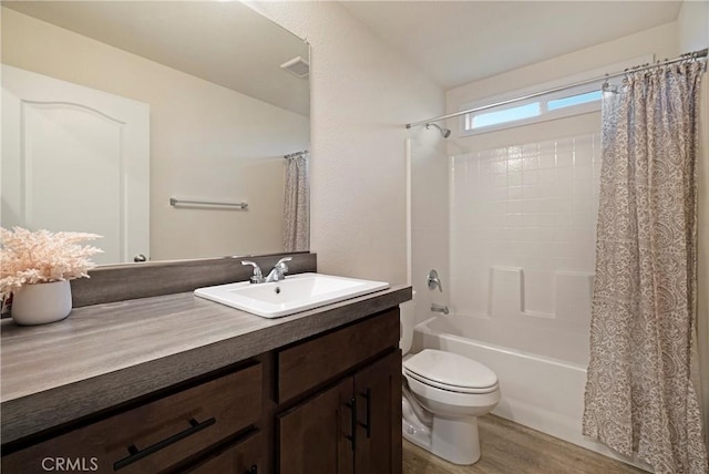 1612 San Jose Ln, Paradise, CA 95969 - bathroom featuring vanity, shower / bathtub combination with curtain, and wood finished floors