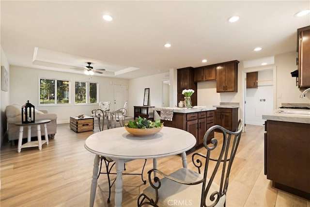 1612 San Jose Ln, Paradise, CA 95969 - dining area with light wood-style floors, a tray ceiling, ceiling fan, and recessed lighting