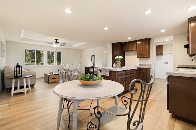 1612 San Jose Ln, Paradise, CA 95969 - dining area featuring light wood finished floors, a raised ceiling, a ceiling fan, and recessed lighting