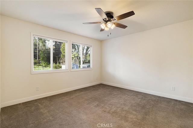 1612 San Jose Ln, Paradise, CA 95969 - unfurnished room featuring dark carpet, a ceiling fan, and baseboards
