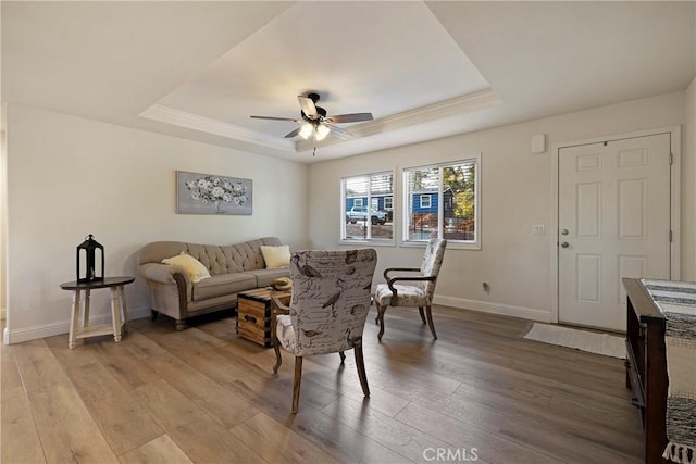1612 San Jose Ln, Paradise, CA 95969 - living room featuring a raised ceiling, a ceiling fan, light wood-type flooring, and baseboards