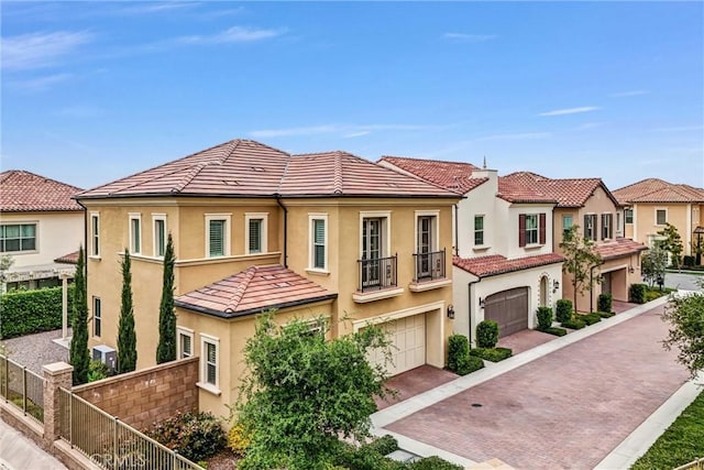107 Plum Lily, Irvine, CA 92618 - townhome / multi-family property featuring a tile roof, a garage, stucco siding, and fence