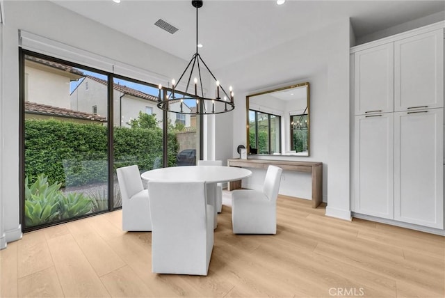 107 Plum Lily, Irvine, CA 92618 - dining room with light wood-type flooring, healthy amount of natural light, a chandelier, and recessed lighting