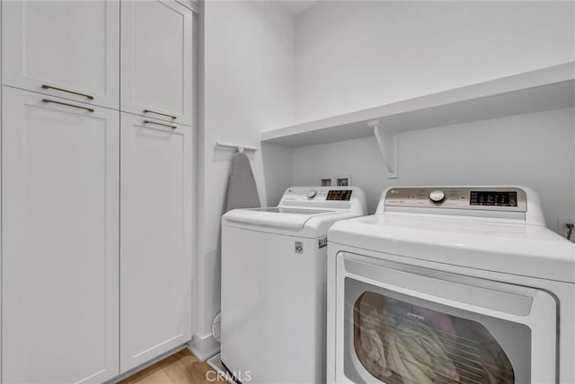 107 Plum Lily, Irvine, CA 92618 - clothes washing area featuring independent washer and dryer and cabinet space