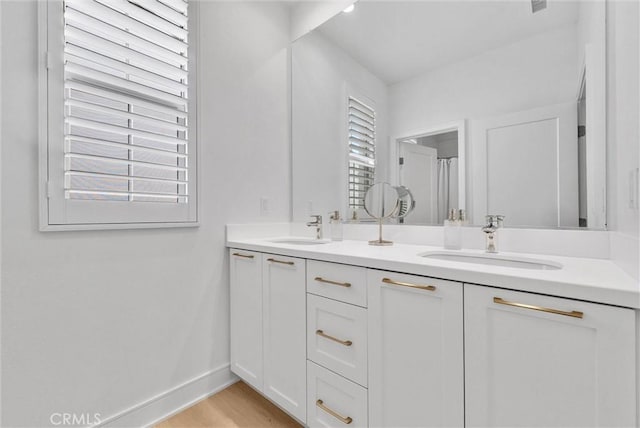 107 Plum Lily, Irvine, CA 92618 - full bathroom with baseboards and double vanity