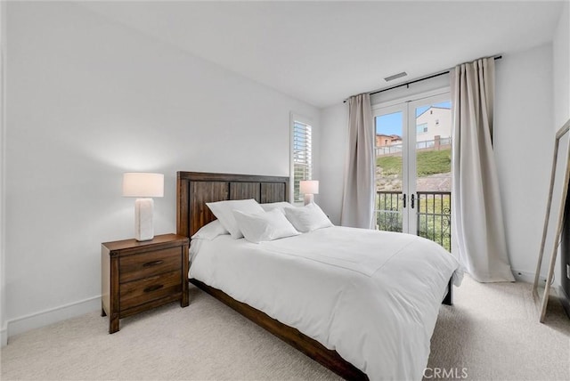 107 Plum Lily, Irvine, CA 92618 - bedroom with light colored carpet, access to exterior, and baseboards