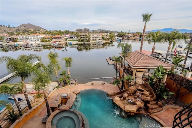 23180 Gray Fox Dr, Canyon Lake, CA 92587 - view of pool featuring a pool with connected hot tub, a dock, and a water and mountain view
