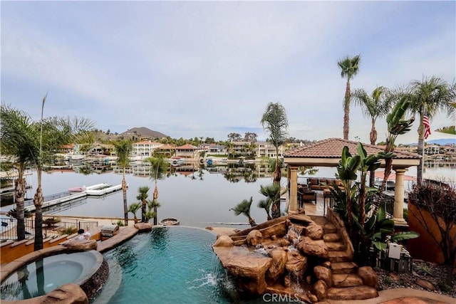 23180 Gray Fox Dr, Canyon Lake, CA 92587 - view of swimming pool featuring a gazebo, a boat dock, a pool with connected hot tub, and a water view
