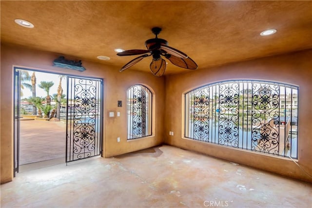23180 Gray Fox Dr, Canyon Lake, CA 92587 - entryway featuring recessed lighting, unfinished concrete floors, and a ceiling fan