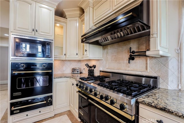 23180 Gray Fox Dr, Canyon Lake, CA 92587 - kitchen featuring black appliances, a warming drawer, ventilation hood, and decorative backsplash