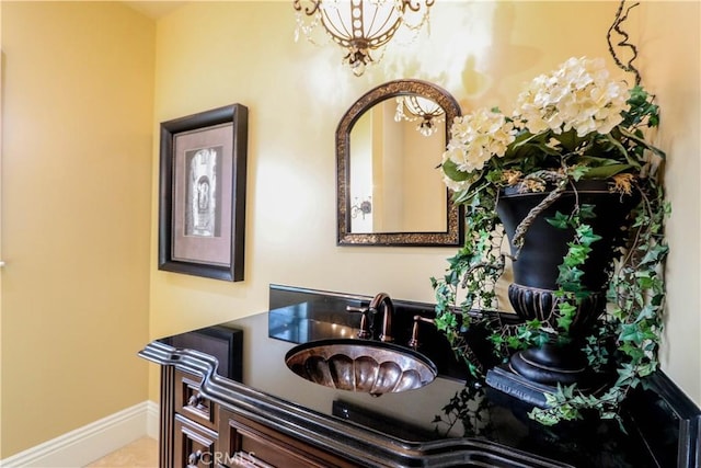 23180 Gray Fox Dr, Canyon Lake, CA 92587 - bathroom featuring a chandelier, baseboards, and vanity