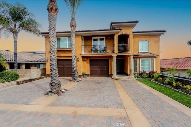 23180 Gray Fox Dr, Canyon Lake, CA 92587 - mediterranean / spanish-style house with a balcony, stucco siding, driveway, and an attached garage