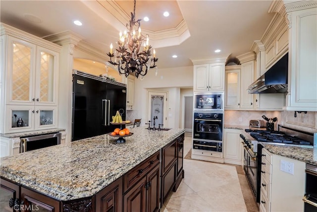 23180 Gray Fox Dr, Canyon Lake, CA 92587 - kitchen featuring black appliances, under cabinet range hood, a warming drawer, decorative backsplash, and recessed lighting
