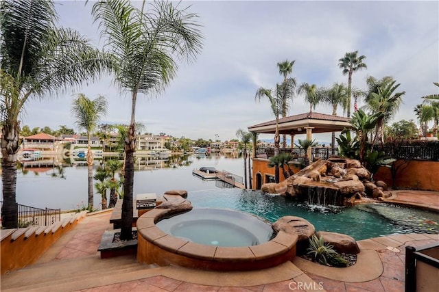 23180 Gray Fox Dr, Canyon Lake, CA 92587 - view of pool featuring a pool with connected hot tub, a water view, a gazebo, and a boat dock