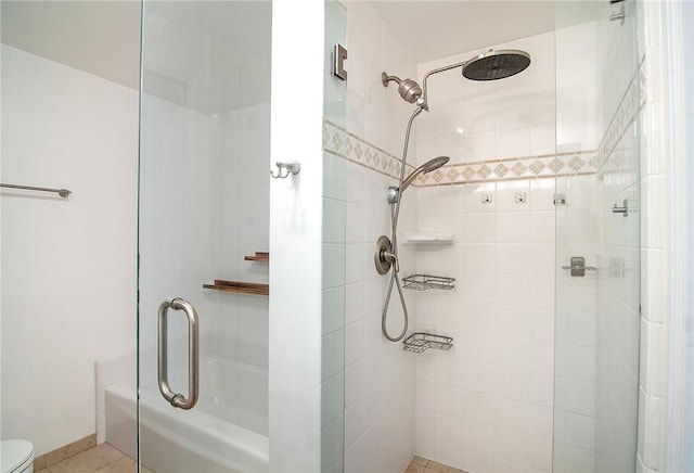 full bath with tiled shower, toilet, tile patterned floors, and a bath