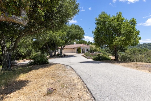 14800 Santa Ana Rd, Atascadero, CA 93422 - mediterranean / spanish house with asphalt driveway and a garage