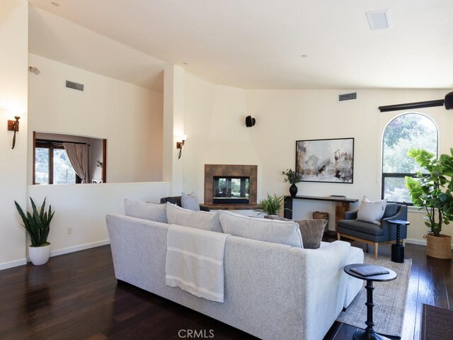 14800 Santa Ana Rd, Atascadero, CA 93422 - living room featuring dark wood-type flooring, baseboards, and a tiled fireplace