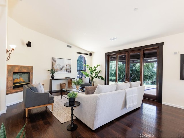 14800 Santa Ana Rd, Atascadero, CA 93422 - living area with healthy amount of natural light, a tile fireplace, dark wood-type flooring, baseboards, and lofted ceiling