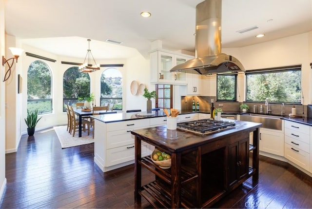 14800 Santa Ana Rd, Atascadero, CA 93422 - kitchen featuring island exhaust hood, stainless steel gas stovetop, dark wood finished floors, a sink, and recessed lighting