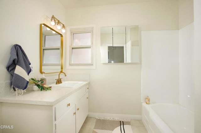 3749 Fairesta St, La Crescenta, CA 91214 - bathroom with tile patterned floors, a bath, vanity, and baseboards
