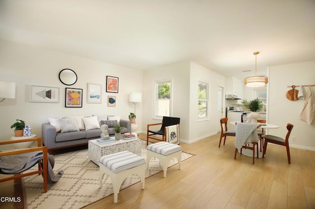3749 Fairesta St, La Crescenta, CA 91214 - living area with baseboards and light wood-type flooring
