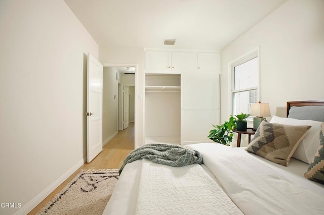 3749 Fairesta St, La Crescenta, CA 91214 - bedroom with light wood-style floors, baseboards, and a closet