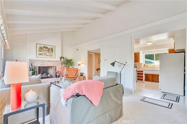 carpeted living room featuring a fireplace