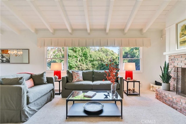 carpeted living room with a chandelier, a brick fireplace, and wooden ceiling
