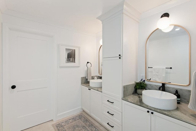 bathroom featuring vanity and baseboards