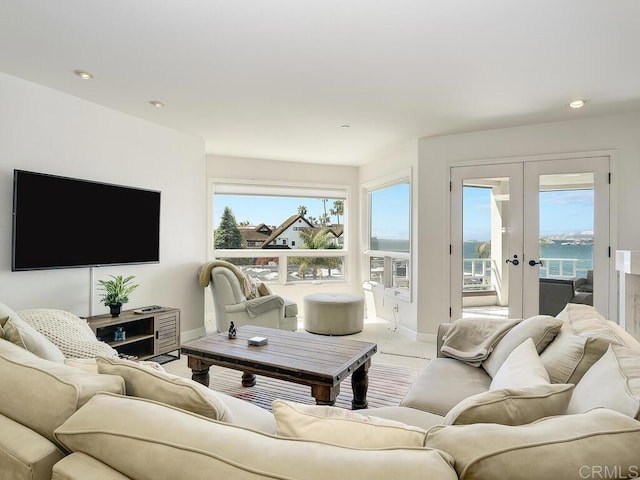 1099 1st St Unit 217, Coronado, CA 92118 - carpeted living room with baseboards, french doors, recessed lighting, and a water view