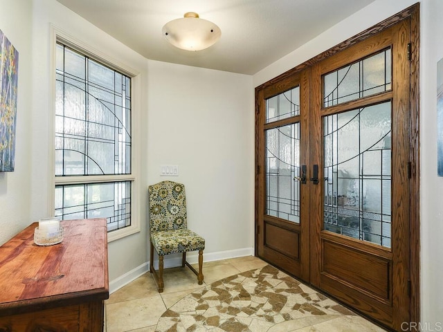 1099 1st St Unit 217, Coronado, CA 92118 - entryway with french doors, baseboards, and light tile patterned floors