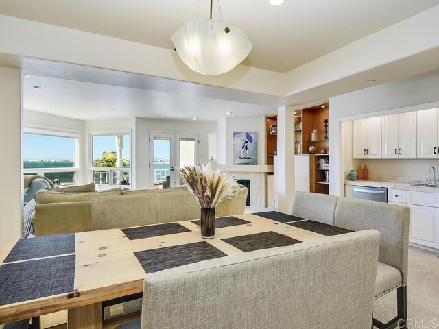 1099 1st St Unit 217, Coronado, CA 92118 - dining space featuring wet bar, light colored carpet, and recessed lighting