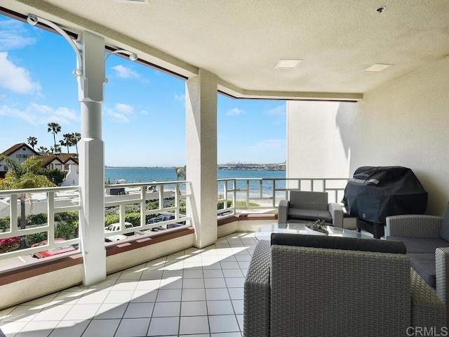 1099 1st St Unit 217, Coronado, CA 92118 - balcony with a water view, a grill, and an outdoor living space