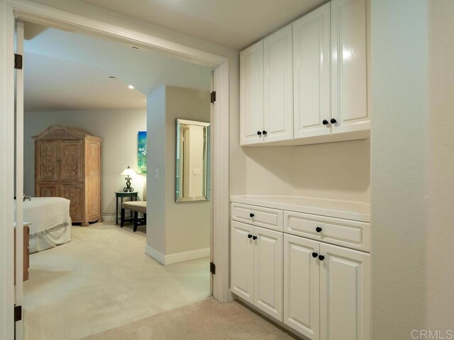 1099 1st St Unit 217, Coronado, CA 92118 - corridor with light carpet and baseboards